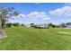 Large backyard providing plenty of space and beautiful landscaping enhancing the overall appeal of the property at 17574 Se 106Th Ave, Summerfield, FL 34491
