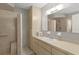Bathroom featuring neutral colors, a large vanity, and a convenient walk-in shower at 17574 Se 106Th Ave, Summerfield, FL 34491