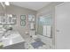 Bathroom featuring a shower-tub combo and plenty of storage space at 17574 Se 106Th Ave, Summerfield, FL 34491