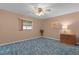 Bedroom featuring a window and a ceiling fan at 17574 Se 106Th Ave, Summerfield, FL 34491