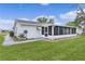 Well-maintained home featuring a screened lanai, offering a comfortable transition between indoor and outdoor living at 17574 Se 106Th Ave, Summerfield, FL 34491
