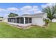 Charming home with a screened-in lanai extension offering additional living space and outdoor enjoyment at 17574 Se 106Th Ave, Summerfield, FL 34491