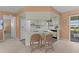Well-lit kitchen with modern appliances and breakfast bar seating at 17574 Se 106Th Ave, Summerfield, FL 34491