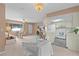 Open-concept living space with a view of kitchen and dining areas at 17574 Se 106Th Ave, Summerfield, FL 34491