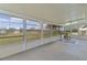 Spacious sunroom with large windows offering serene views of the surrounding landscape at 17574 Se 106Th Ave, Summerfield, FL 34491