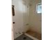 Bright bathroom featuring a shower at 20621 Se Highway 42, Umatilla, FL 32784