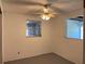 Bright bedroom featuring a window and a ceiling fan at 20621 Se Highway 42, Umatilla, FL 32784