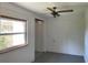 Bright bedroom featuring a window and access to the closet at 20621 Se Highway 42, Umatilla, FL 32784