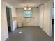 Spacious kitchen featuring a window and access to other rooms at 20621 Se Highway 42, Umatilla, FL 32784