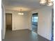 Bright living room featuring light fixtures and access to other rooms at 20621 Se Highway 42, Umatilla, FL 32784