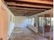 Enclosed sunroom with tile floor, windows, ceiling fan, and door leading to outside at 20621 Se Highway 42, Umatilla, FL 32784