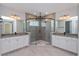 Luxurious bathroom with a large walk-in shower and double vanity at 10092 Ballast Dr, Orlando, FL 32827