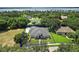 Bird's-eye view of a home with a large backyard and a lake nearby at 11529 Osprey Pointe Blvd, Clermont, FL 34711