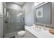 Bathroom with gray tile shower and modern vanity at 11529 Osprey Pointe Blvd, Clermont, FL 34711