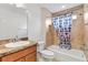 Bathroom with shower/tub combo and polka dot curtain at 3732 Barrel Loop, The Villages, FL 32163