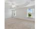 Bedroom with neutral carpet and a view of the yard at 3732 Barrel Loop, The Villages, FL 32163