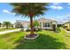 House exterior showcasing a palm tree and well-manicured lawn at 3732 Barrel Loop, The Villages, FL 32163