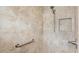 Accessible shower with tiled walls and safety features at 3732 Barrel Loop, The Villages, FL 32163