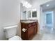 Bathroom with granite countertop, vanity, and tiled floor at 1338 Neuport Path, The Villages, FL 32163