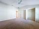 Bedroom featuring a ceiling fan, an attached closet, and neutral walls at 1338 Neuport Path, The Villages, FL 32163