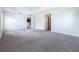 Bright primary bedroom with open doorway to kitchen at 1338 Neuport Path, The Villages, FL 32163