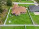 Aerial view of fenced backyard with play set and covered patio at 8830 Se 161St Pl, Summerfield, FL 34491