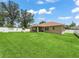 Well-maintained backyard with lush grass and play equipment, perfect for outdoor activities at 8830 Se 161St Pl, Summerfield, FL 34491