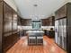 Gourmet kitchen with granite countertops, stainless steel appliances, and kitchen island at 8830 Se 161St Pl, Summerfield, FL 34491