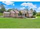 House with stone accents and landscaping at 15634 Vista Verde Dr, Montverde, FL 34756