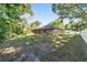 Enjoy the expansive backyard with a covered patio and mature trees at 8566 Se 156Th Pl, Summerfield, FL 34491