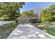 Charming single Gathering home with a well manicured front lawn, a two-car garage, and sidewalk at 8566 Se 156Th Pl, Summerfield, FL 34491