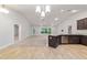 This open kitchen flows into a living room with stainless steel appliances and granite countertops at 8566 Se 156Th Pl, Summerfield, FL 34491