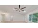 Bright living room boasts a ceiling fan, recessed lighting, and large windows at 8566 Se 156Th Pl, Summerfield, FL 34491