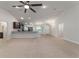 Bright and airy living area with a view to the kitchen, breakfast nook and lots of natural light at 8566 Se 156Th Pl, Summerfield, FL 34491