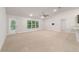 Bright living space with a ceiling fan and sliding glass door leading to the backyard at 8566 Se 156Th Pl, Summerfield, FL 34491