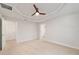 Empty main bedroom with tray ceiling and access to two doorways at 8566 Se 156Th Pl, Summerfield, FL 34491