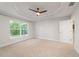 Spacious main bedroom with a large window for natural light and a walk-in closet at 8566 Se 156Th Pl, Summerfield, FL 34491