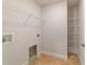 Spacious walk-in closet with ample shelving and a place for a washer and dryer at 8566 Se 156Th Pl, Summerfield, FL 34491