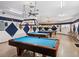Well-lit billiards room with multiple pool tables at 1209 Apache Cir, Tavares, FL 32778