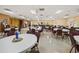 A spacious community room features tables, chairs, and ample space for events at 1209 Apache Cir, Tavares, FL 32778