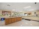 A bright community room featuring a large counter, kitchen area, and informational boards at 1209 Apache Cir, Tavares, FL 32778