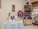A tastefully decorated table and cabinet displaying patriotic and decorative items in the room at 1209 Apache Cir, Tavares, FL 32778