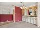 Dining area featuring neutral carpet, a decorative chandelier, and built-in cabinets at 1209 Apache Cir, Tavares, FL 32778