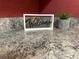 Close up of kitchen counter with welcome sign at 1209 Apache Cir, Tavares, FL 32778