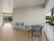 Inviting patio area with chairs and table for outdoor relaxation and entertaining at 1209 Apache Cir, Tavares, FL 32778