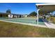 Multiple shuffleboard courts, with an outdoor seating area, provide a recreational opportunity for residents at 1209 Apache Cir, Tavares, FL 32778