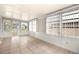 Bright sunroom with tile flooring, large windows, and ample natural light at 1209 Apache Cir, Tavares, FL 32778