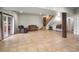 Spacious finished basement with tile floors, a staircase, and sliding door access to the outdoors at 26348 Se Highway 42, Umatilla, FL 32784