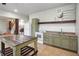 A secondary kitchenette with white appliances and a sink in a finished basement at 26348 Se Highway 42, Umatilla, FL 32784
