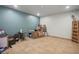 Basement space featuring a table, storage boxes, and a rustic wooden ladder at 26348 Se Highway 42, Umatilla, FL 32784